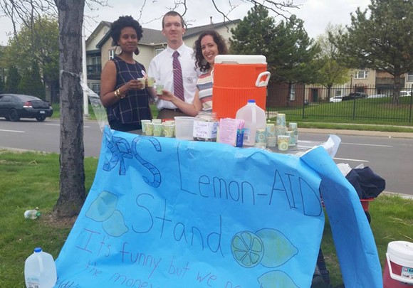 "Michigan legislators have refused to audit the finances of DPS. We set up a lemonade stand to help them fundraise. Now what's the excuse?" says DPS teacher Nina Chacker, right, who stands with fellow DPS teachers Zack Sweet and Kiarra Ambrose.