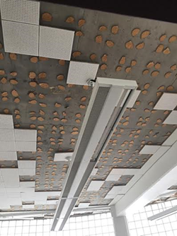 Ceiling in the Detroit Institute of Technology with missing tiles before renovation. - photo credit: National Network of Arab Communities