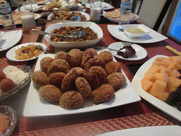 In the foreground, Bangladeshi-style kebabs. - PHOTO BY SERENA MARIA DANIELS