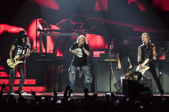 Duff McKagan, left, Axl Rose, and Slash at the "Not In This Lifetime..." tour opener at Ford Field in Detroit on Thursday. - Photo by Mike Ferdinande