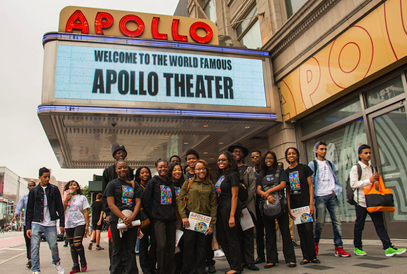 The Mosaic Youth Theatre group poses in front of New York's Apollo Theater. - Photo courtesy Mosaic Youth Theater