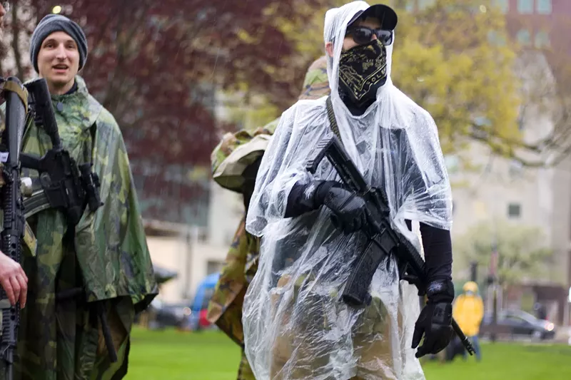 Armed protesters in Lansing on Thursday. - Steve Neavling