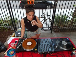 Jen David, aka Jenny Junior, spinning records. - Photo by Serena Maria Daniels