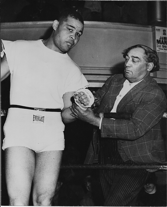 Joe Louis, left, and the intriguing Henry Johnson, right. Referred to in Maraniss' account as "Pappa Dee," a driver, Johnson was a hustler in the black community who ran a barbershop and "managed" boxers. - Illustration from 'Once in a Great City'