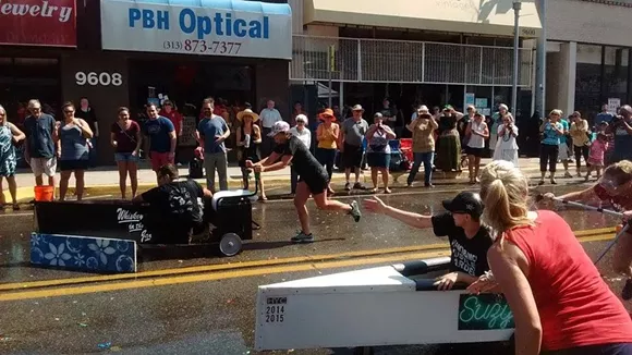 The front of the Whiskey's canoe is blocked by a goal marker, providing just enough drag to almost give Suzy's the win. - Photos by Michael Jackman