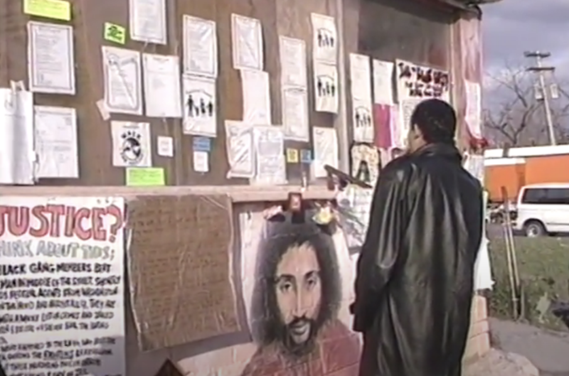 The Malice Green mural painted by Bennie White at the scene of his death in Detroit. - Screen grab/YouTube