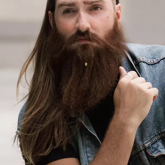 A hipster with beard jewelry. Sadly, this is not a joke. - via Instagram