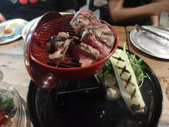 The "High Steaks" is served in a mini Weber grill replica and a side of "Willie Nelson Tater Salad." - PHOTO BY SERENA MARIA DANIELS