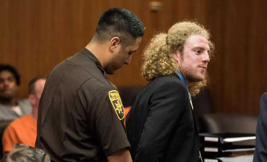 Andrew Cissell, a marijuana rights activist who was instrumental in Ferndale’s decriminalization vote, stands in Oakland County Circuit Court Judge Hala Jarbou’s courtroom on July 11 for sentencing on a conviction of illegal sale of medical marijuana. - Photo by Mike Ferdinande.