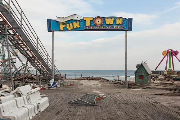 “Pier Entrance, Fun Town Amusements, Destroyed by Hurricane Sandy, Seaside Park, New Jersey, 2013. Elevation Sixteen Feet. N 39.94122 W 74.07093.” - Photo by John Ganis.