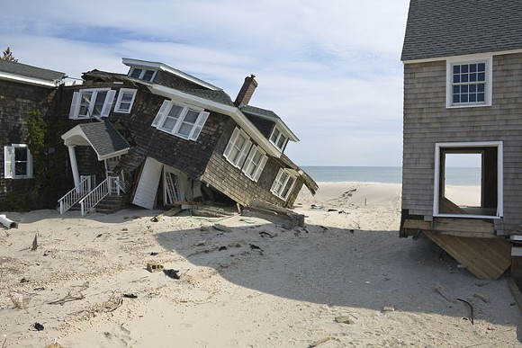 "Beach Houses after Hurricane Sandy, 959 East Avenue, Mantoloking, New Jersey, March 2013. Elevation Nine Feet. N 40.05418 W 74.04623." - Photo by John Ganis.