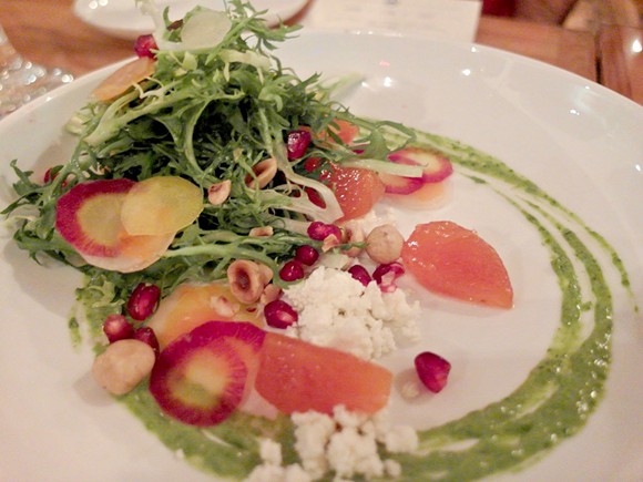 The winter persimmon salad, with frisee, fuyu persimmon, pomegranate, hazelnut, buttermilk cheese, and green goddess dressing. - Photo by Serena Maria Daniels