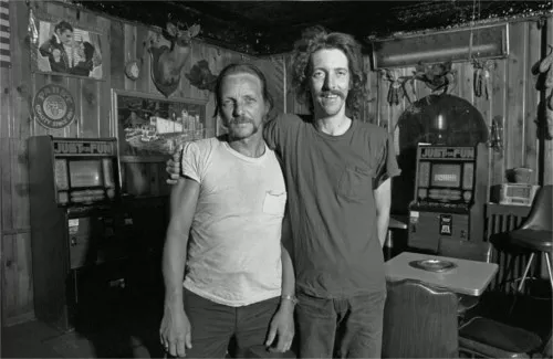This photo, titled "Buddies," shows two friends hanging out at the Buckhorn Inn. Harkness says, "The Buckhorn Inn stood for years on the corner of Ferry St. and Dubois. It burned down around 1990. It was situated just west of the still extant but abandoned Chene-Ferry Market. The owner was Walter Miller." - Photo courtesy Bruce Harkness