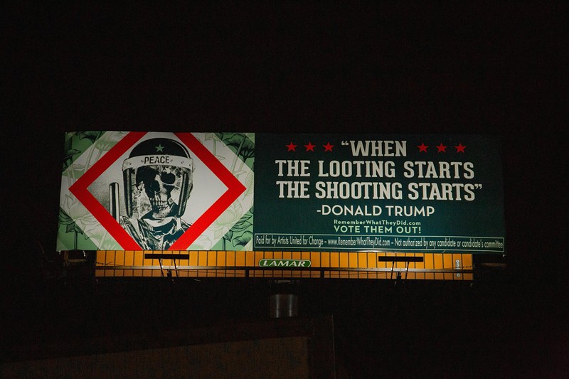 Shepard Fairey's billboard addressing President Trump's violent rhetoric. - Casey Chamberlain