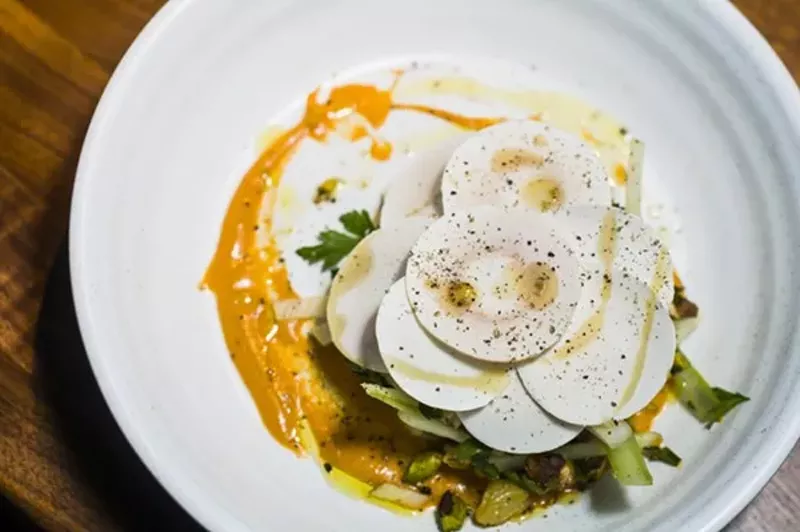 Magnet's apple and celery salad with shaved mushroom and persimmon purée. - Tom Perkins