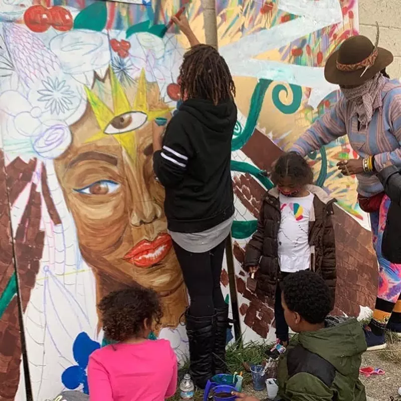 Artist Dana Selah Elam is honored with mural, which was recently created as part of a community workshop called The Honor Project. The mural will be on display at the Boll Family YMCA in downtown Detroit. - Cameron Jenkins