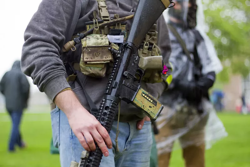Armed protesters rallied against Gov. Gretchen Whitmer's coronavirus restrictions in May. - Steve Neavling