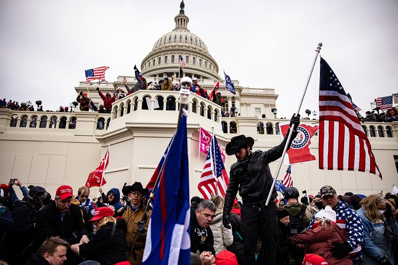 Pro-Trump supporters storm the U.S. Capitol following a rally with President Donald Trump on January 6, 2021 in Washington, D.C. - Alex Gakos / Shutterstock.com