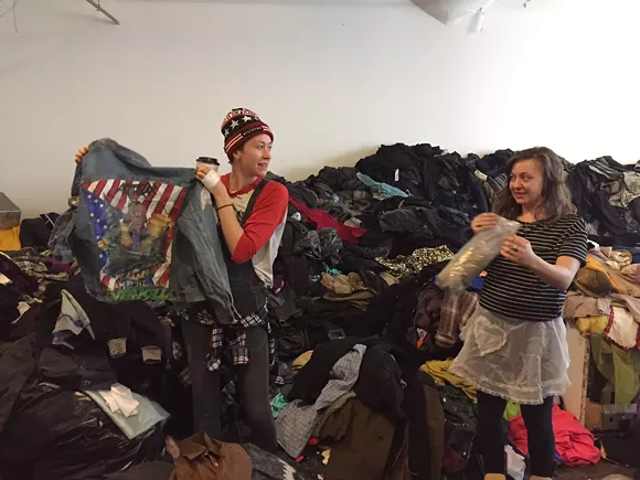 Russell tenant Kory Trinks begins the process of packing up thousands of pounds of vintage wares. - Violet Ikonomova