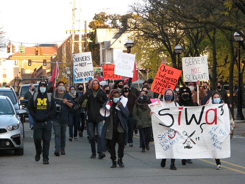 Members of the Service Industry Workers of the Ann Arbor Area (SIWA3) march in October. - Elise Brehob