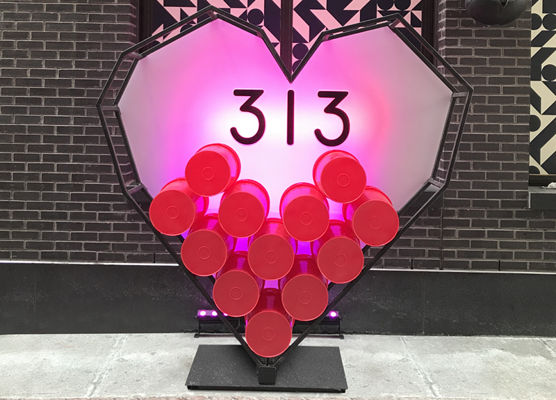 Melinda Anderson of Studio M Detroit partnered with Bedrock Detroit and Prop Art Studio to place a 313 Day installation in Parker’s Alley. The heart-shaped structure with "313" in the middle is the perfect spot to take 313 Day selfies. - Photo by Melinda Anderson @studiomdetroit
