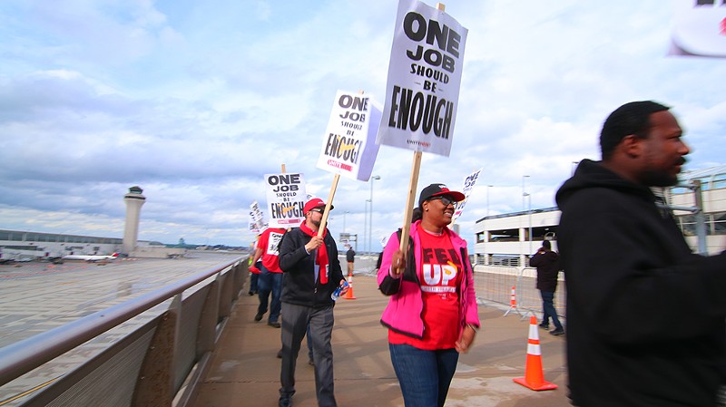 Shandolyn Lewis, center, and other union workers protesting at the Detroit Metropolitan-Wayne County Airport Terminal. - Unite Here