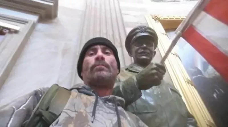 Anthony Robert Williams poses next to statue in U.S. Capitol. - FBI