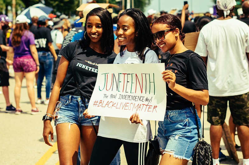 Young women celebrate Juneteenth in Grant Park, Chicago on June 19, 2020. - Antwon McMullen / Shutterstock.com
