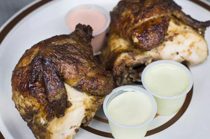 Rotisserie chicken with green and orange sauce. - Tom Perkins