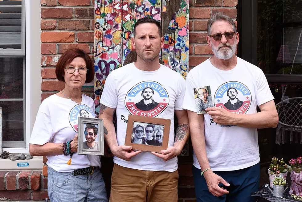 Journalist Danny Fenster’s family, from left: Buddy, Bryan, and Rose, at their Huntington Woods home. - Kelley O’Neill