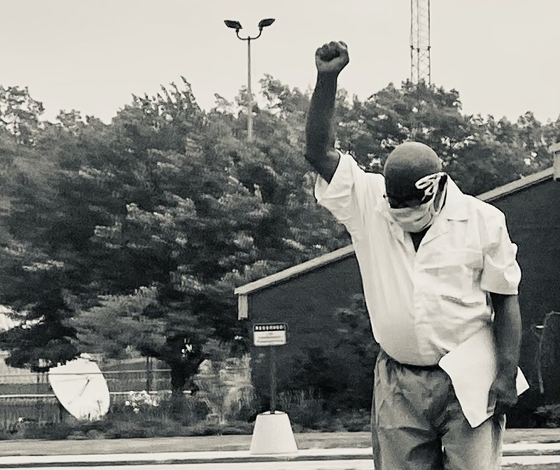 Ray Gray walks out of a state prison in Muskegon after 48 years behind bars, Tuesday, May 25, 2021. - Photo by Dave Mesrey.