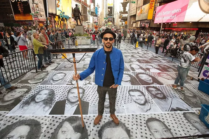JR presents his ongoing 'Inside Out 11M' project. - Courtesy of LIbrary Street Collective