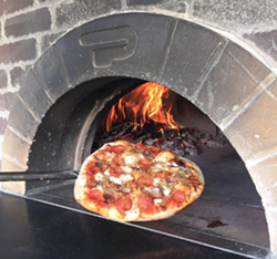 A Wood Fired Up pizza. - WOOD FIRED UP FACEBOOK PAGE.