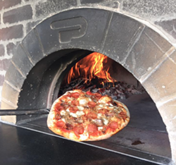 A Wood Fired Up pizza. - Wood Fired Up Facebook Page.