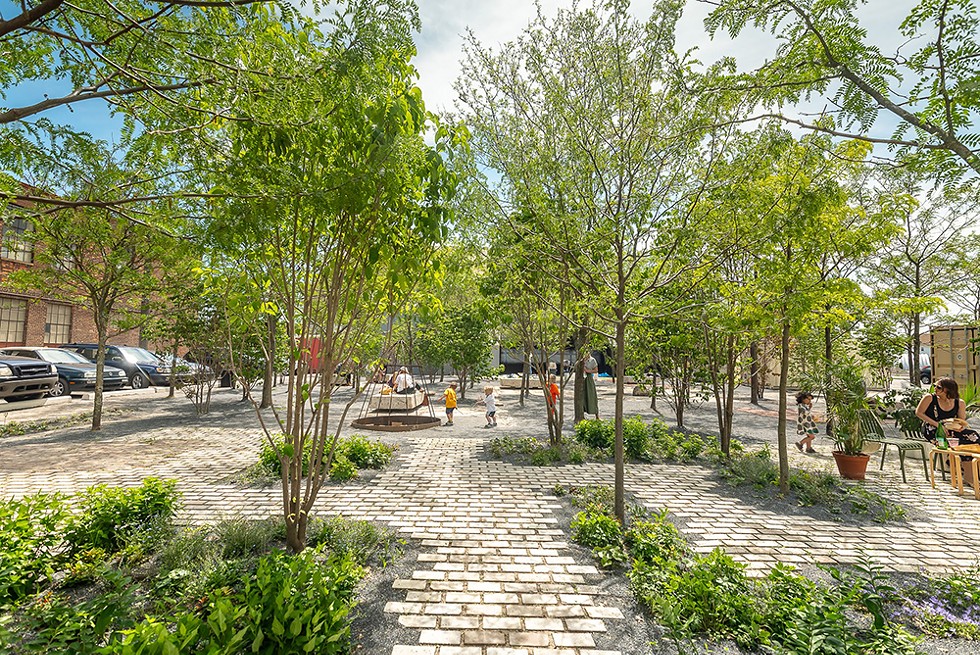 A former parking lot is now Core City Park, an inviting courtyard plaza surrounded by new businesses. - Chris Miele