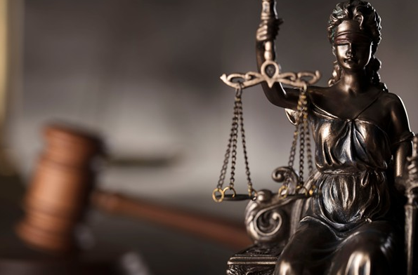 The Michigan Supreme Court will take up a law that allows judges to charge defendants to cover the costs of operating the courts. - Shutterstock