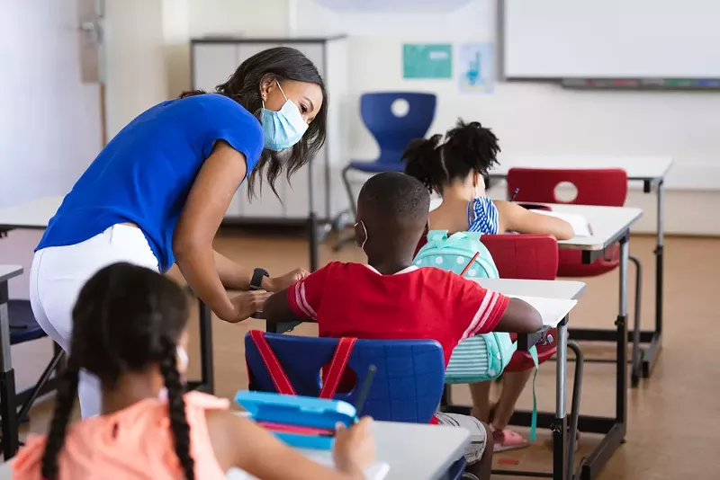 Schools without masks mandates are reporting the largest outbreaks in Michigan. - Shutterstock