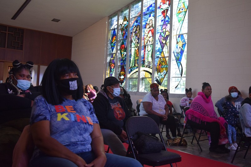 Benton Harbor residents gather inside God’s Household of Faith church Saturday. - Anna Gustafson / Michigan Advance
