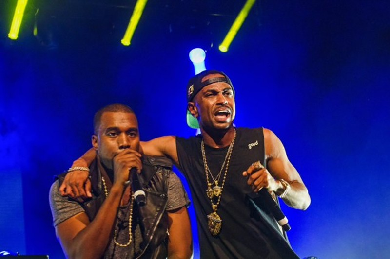 Kanye West and Big Sean performing together in 2012. - DOUG COOMBE
