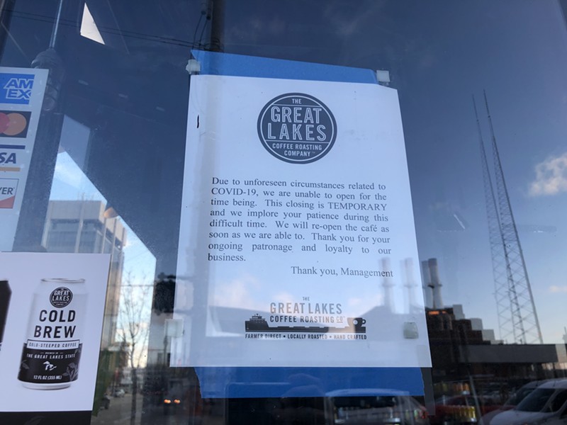 A sign posted on Great Lakes Coffee's windows says it's closed indefinitely. - LEE DEVITO
