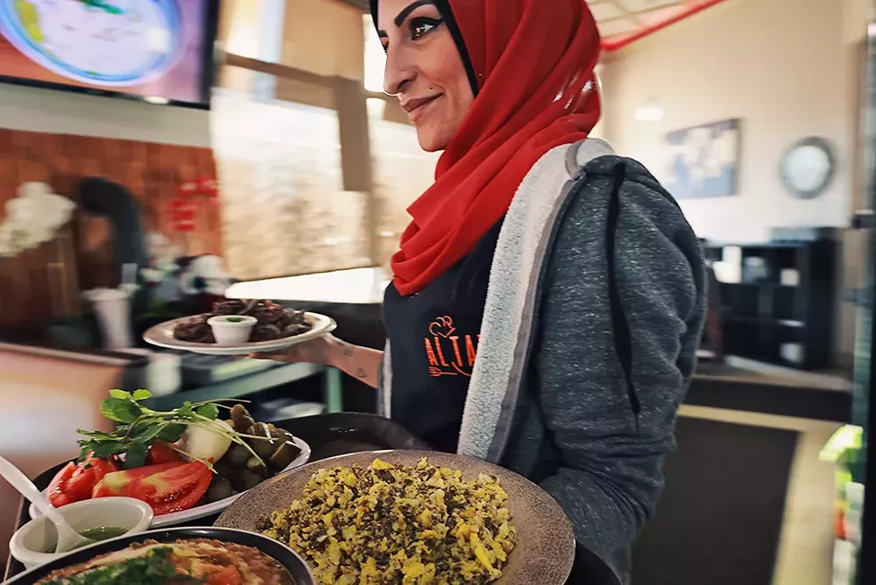 Susan Zaher serves the busy breakfast crowd, often educating first-time customers about traditional Lebanese breakfast dishes. - CYBELLE CODISH