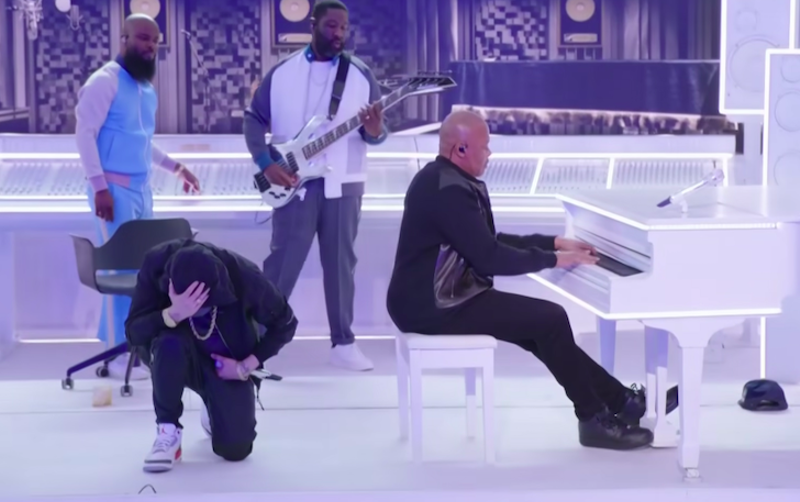 Eminem takes a knee during Pepsi Super Bowl Halftime Show performance. - SCREENGRAB VIA NFL / YOUTUBE