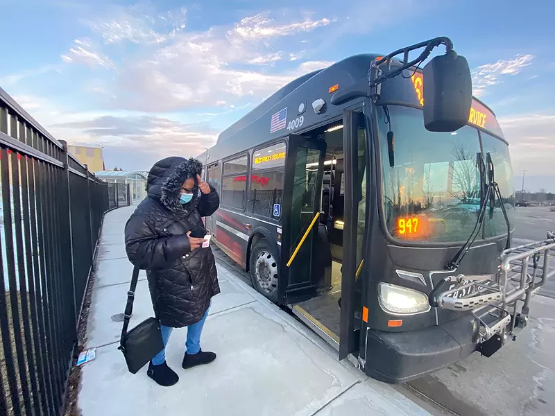 Pontiac resident Christina Cowart catches the bus to return home after work at Great Lakes Crossing on Monday. Hours later, the Auburn Hills City Council voted to opt out of SMART. - Nina Ignaczak