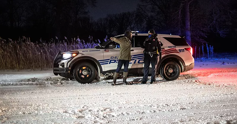 Detroit Sugarbush Project organizer Antonio Cosme speaking with police on Friday, Feb. 18. - COURTESY OF ROSA MARÍA ZAMARRÓN