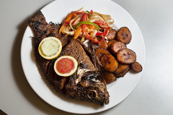 Grilled tilapia with plantains and marinated onions. - Tom Perkins
