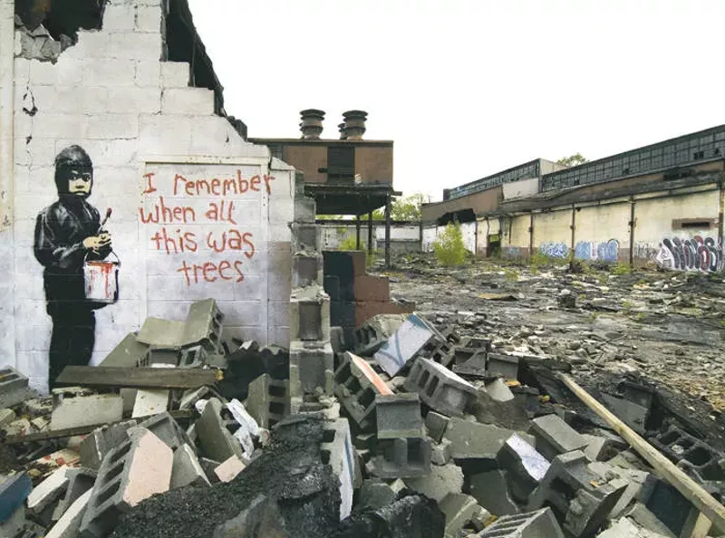 The Banksy at Detroit's abandoned Packard Plant before its removal. - Billyvoo
