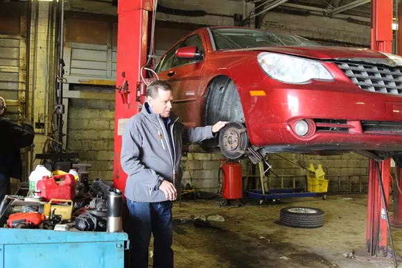 Tony Greiner in his Metro 25 auto shop on Detroit’s east side. - Sarah Rahal