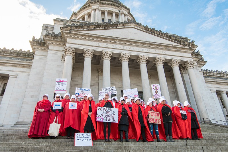 Abortion rights activists dress up as characters from The Handmaid's Tale at a protest. - PHIL LOWE/SHUTTERSTOCK.COM