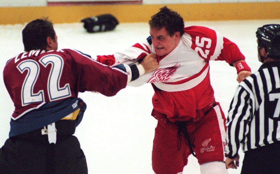 Detroit Red Wing Darren McCarty and Colorado Avalanche Claude Lemieux duke it out three seconds into Tuesday night's game at Joe Louis Arena, Nov. 11, 1997. - David P. Gilkey, Detroit Free Press