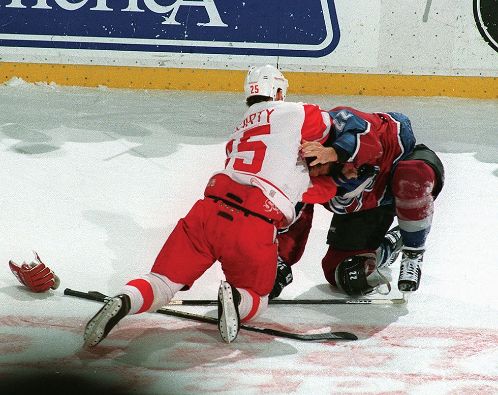 Red Wing Darren McCarty and Colorado Avalanche Claude Lemieux fight during first-period action at Joe Louis Arena. - Julian H. Gonzalez, Detroit Free Press